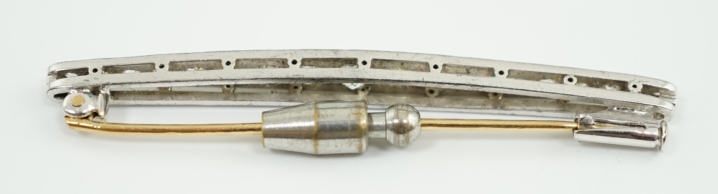 An early to mid 20th century platinum and graduated eighteen stone diamond set bar brooch
